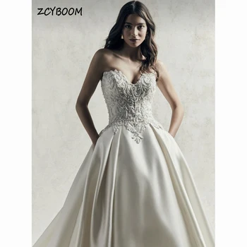 Elegáns kedvesem gyöngyös rátétjei ujjatlan esküvői ruha 2023 pánt nélküli A-vonalú padlóhosszas seprő vonat foltos menyasszonyi ruha